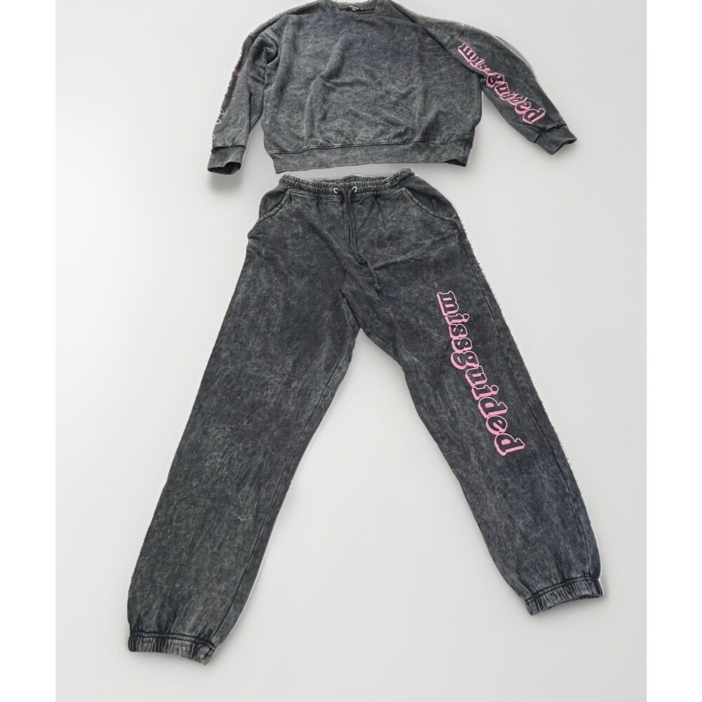 Missguided black acid wash sweatpants with pink graphic lettering